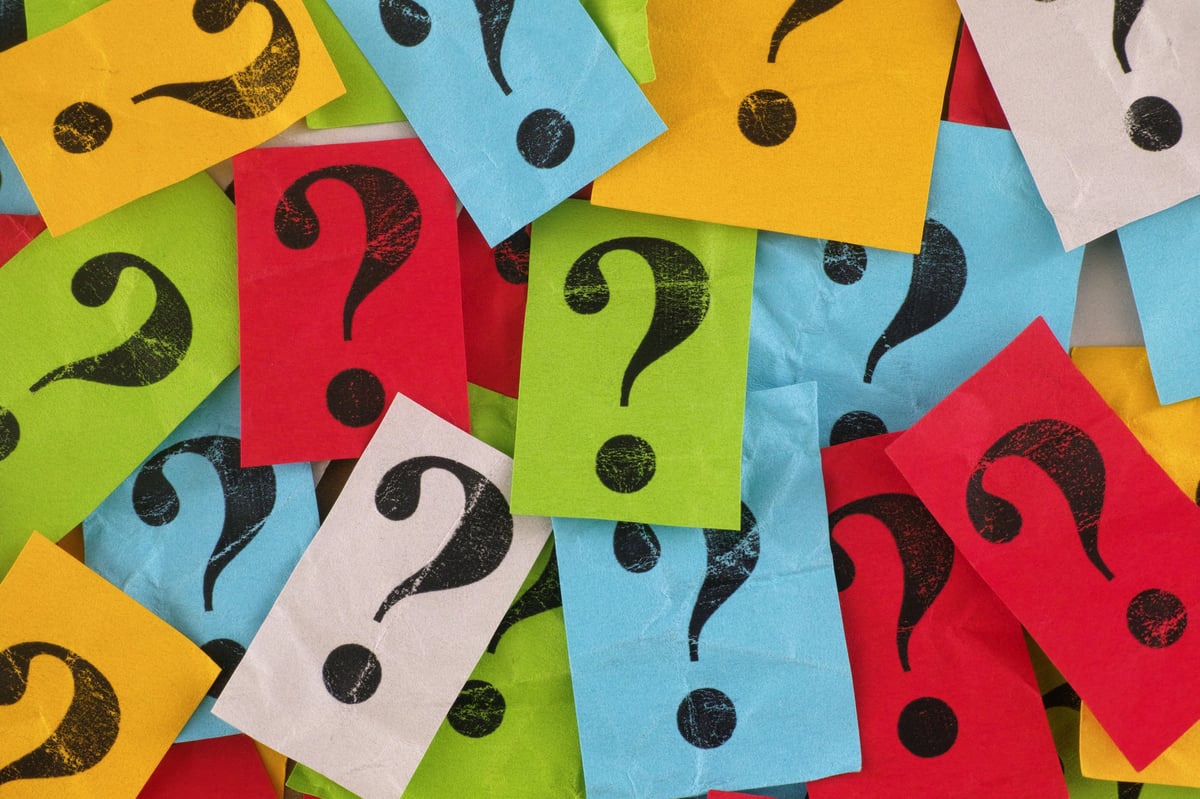 Colorful paper notes with question marks