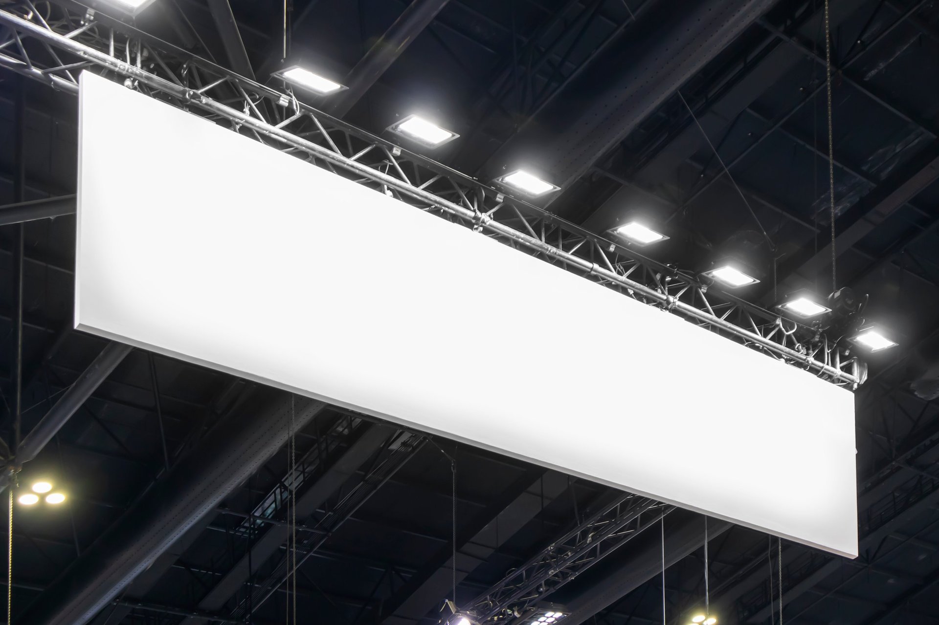 Large brand sign hanging from ceiling for exhibition display
